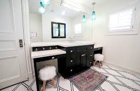 The classic black and white combination always looks the part, regardless of whether a bathroom is brand new or has been around for decades. Black And White Mixed Penny Tile Floor Transitional Bathroom