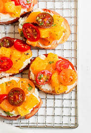 Spread cheese out on bread, top with roasted tomatoes, fresh basil, and a drizzle of balsamic reduction. Orange And Goat Cheese Bruschetta Sprinkles Sea Salt