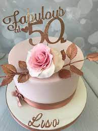 Nobody likes to get old or to welcome the wrinkles which get added upon every birthday but there is a certain sense 50 is a big number and so should be the 50th birthday cake for him and her. Elegant 50th Birthday Cake With Hand Made Rose 50th Birthday Cake For Mom 50th Birthday Cake For Women 50th Birthday Cake Toppers