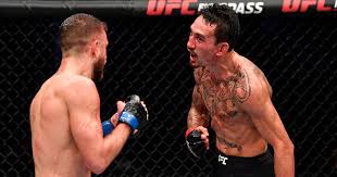 Blessed secured the win with a dominant points triumph over kattar at the etihad arena on fight island in abu dhabi. Max Holloway Trash Talks At Commentators While Evading Calvin Kattar S Punches Mirror Online