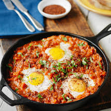 Shakshuka definition, a dish of north african origin consisting of eggs poached or baked in a spicy tomato sauce with bell peppers and onion. Shakshuka Rooted Spices Single Origin Spices Unique Blends And Beautiful Gift Sets