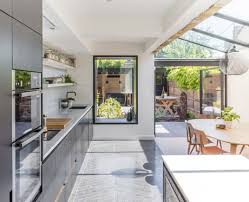 The tiny house movement isn't necessarily about sacrifice. House Extension Containing A Kitchen And Dining Space Under A Skylight Opening Up To A Small Garden With A Sauna Hackney London Uk 9gag