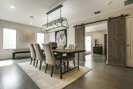 Spindle chairs for modern take on farmhouse. 75 Beautiful Farmhouse Dining Room Pictures Ideas July 2021 Houzz