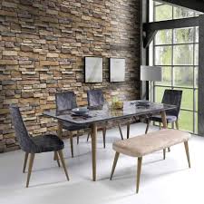 The concrete walls can create a monotone and gloomy ambiance in the living room, therefore a stacked stone wall is a great idea for preventing that to happen. 10 Stylish Accent Walls To Dress Up Your Dining Room