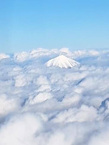 Mount Shasta in the Cascades from airplane window