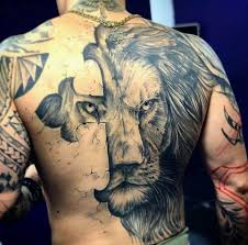 Beautiful cross made in flower pattern back tattoo. 12 Best Lion Cross Tattoo Designs Petpress