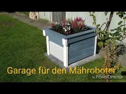 Garage Fur Den Mahroboter Rasen Roboter Mit Rolltor Youtube Rasenroboter Garage Rolltor Rasenroboter
