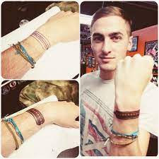 His tattoos include a symbol of the scorpio zodiac, a heart on his sleeve, a sign of peace surrounded by the elements, a sugar skull, and a tattoo of his dog, sissy. New Ink In The Years Of Being In Btr I Ve Been Given Thousands Of Bracelets This Tattoo Is For All The Ones I Can T We Kendall Schmidt Big Time Rush Kendall