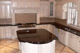 A white granite slab truly looks incredible wherever it is installed in the home. Tan Brown Granite Kitchen Countertops With White Kitchen Cabinets Brown Granite Countertops Tan Granite Countertops Granite Countertops Kitchen