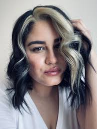 However, the colored strands are much larger and more prominent than with highlighting, creating more of a contrast with your base color. Black And Blonde Black Hair Blonde Streak Blonde Streaks Blonde Hair Looks