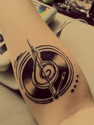 This design has a guitar going through a skull's head. Pin By Linda Benedetti On Ink Music Tattoos Record Player Tattoo Tattoos