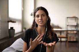 Mature woman talking at camera ...