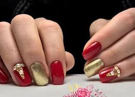 Red And Gold Nail With Rhinestones Red Nails Red And Gold Nails Gold Nails Sample of nails display red nails with white design cat eye white color white nails with red silver.