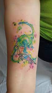 Autism awareness concept with hand of puzzle pieces as symbol. Watercolor Origami Dinosaur Tattoo 3 By Dawn Yermasek Cute Dinosaur Tattoo Dinosaur Tattoos Tattoos