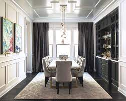 I added board and batten along with crown molding to this room. Black And White Transitional Dining Room With Gray Curtains Hgtv