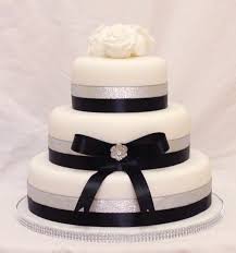 The red roses create a sense of depth and alternate sized middle tier is a nice touch. Wedding Cakes Bev S Cakes