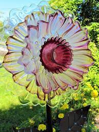 My glass garden flowers have been designed and crafted from handpicked unique glassware. Pin On Glass Garden Art