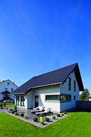 Gepflasterte Terrasse Mit Sonnenliegen Und Garten Fingerhaus Terrasse Pflastern Fertighaus Kaufen