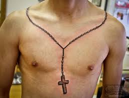 Two cross tattoos on side rib of a man. 40 Latest Necklace Tattoos Ideas