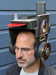 I made headphones with integrated CD player, remote control, battery, disc  storage, and jewel box compartment"