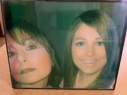 Can someone clean this pic of my mom and me? Thanks.