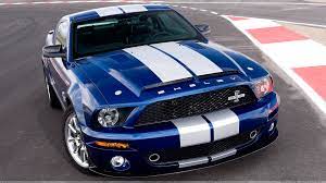 Front Top Pose Of 2008 Ford Shelby Gt500kr In Blue On Racing Track Wallpaper
