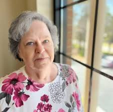 Who are the individuals in the old photo?