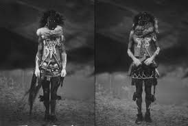 Ancient petroglif of monster slayer. Two Navajo Men Garbed In Tradition As The Gods Nayenezgani Slayer Of Alien Gods And His Twin Brother Tobadzischini Born Of Water The Navajo Tribe Believed That They Roamed The Earth And