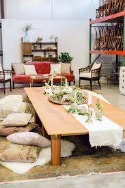 Bohemian Floor Seating With Modern Low Tables And Pink Pillows On A Gray And Blue Rug Via Birch Brass Vintage Rentals Fo Floor Seating Floor Table Low Tables