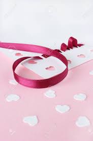 Free shipping on +$100 orders. A Close Up Image Of Card Making Supplies Including Red Ribbon And White Heart Confetti On A Pink Background Stock Photo Picture And Royalty Free Image Image 17443844