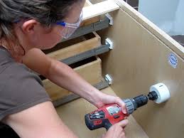 Put the cabinet into the blocking and push it gently but firmly, so the face frame is flush with the wall. How To Install A Vanity And Storage Cabinets How Tos Diy