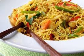 Because of the curry powder used in the recipe, the noodles taste spicy. Singapore Noodles Are The Real Deal The Gazette