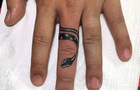 On finger too, you can get it made near the knuckles or even below where the wedding ring is supposed to be. Top 22 Finger Tattoo Designs Snake Ideas Petpress