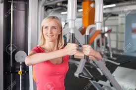 The most critical factor in choosing the right gym is finding one that fits your personal needs and goals. Pretty Young Blond Woman Is Training In Gym She Is Working With Stock Photo Picture And Royalty Free Image Image 44987382