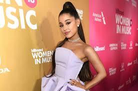 ariana grande breaks record for most simultaneous top 40