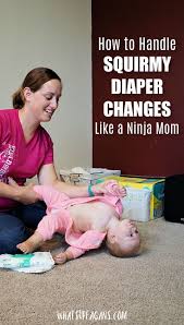 How To Handle Those Squirmy Diaper Changes Like A Mom Ninja Diaper Changing Baby Diapers Diaper Toddler