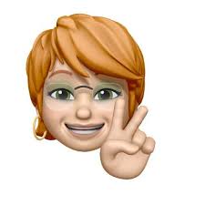 Fresno Police officer Katrina Lloyd flashes a peace sign to protesters as  they pass police headquarters, Sunday afternoon. A message from Police  Chief Hall