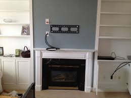 First, remove the material protecting the cord cover. Tv Wall Mount Installation With Wire Concealment Over Fireplace