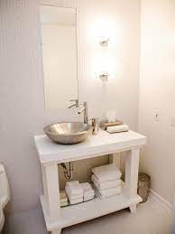The All White Small Space Bathroom Features Full Length Tile Walls And Flooring The Contempo Small Bathroom Vanities White Vanity Bathroom Diy Bathroom Vanity