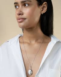 Sun Moon and Star 0.63 ct White Sapphire Oval Galaxy Locket in Sterling  Silver, 22