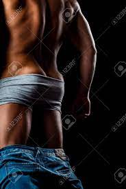 Sexy Man With Muscular Body And Bare Torso. Muscular Butt. Back View Of A  Muscular Man Posing On Black Background. Stock Photo, Picture and Royalty  Free Image. Image 142130029.