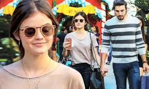 Lucy Hale gets hand held by Anthony Kalabretta while Christmas shopping