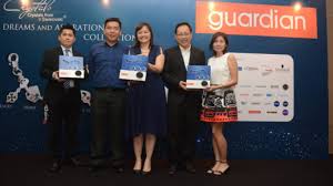 Mengemaskini imej dan jenama syarikat dan warna korporat daripada biru gelap kepada oren terang. Guardian Charms