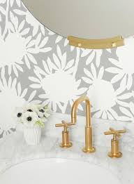 They tend to be smaller rooms in your home, and there aren't a lot of other gold zebras gallop around the black walls of this modern bathroom, giving playful energy to the space. White And Gold Bathroom With Gray Wallpaper Transitional Bathroom