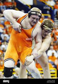 Heavyweight wrestler Steve Mocco of Oklahoma State (L) fights off a  takedown attempt by Minnesotas Cole Konrad in the 2005 NCAA Division 1  Wrestling Championships at the Savvis Center in St. Louis,