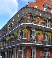 The french quarter is the oldest and most famous neighborhood in new orleans frequented by both visitors & locals alike. A Christmas Greeting Peace Y All On A French Quarter Building In New Orleans Photograph By Tom Wurl
