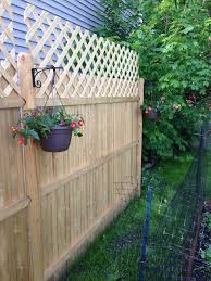 Awe Inspiring Hanging Plants On Fence Think About Coloring In A Special Stencil On Every One Of Your Fen Backyard Fence Decor Hanging Plants On Fence Backyard