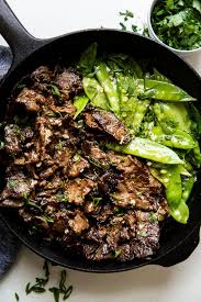 Garlic Butter Steak Stir Fry With Snow Peas The Modern Proper Recipe Steak Stir Fry Keto Stir Fry Steak Butter