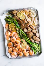 Old Bay Shrimp And Sausage Sheet Pan Dinner The Modern Proper Recipe Sheet Pan Dinners Sheet Pan Recipes Clean Eating Snacks