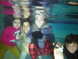 Girls Having Fun Underwater With Winter Clothes Underwater Fun Underwater Drawing Underwater Theme